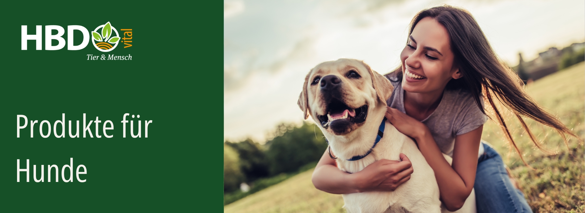 Hundeprodukte von HBD Glücklicher Hund mit einer Frau im Freien vor grünem Hintergrund, Headergrafik des Hundeshops